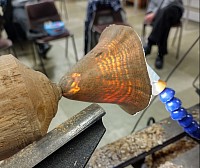 Thin walled turned wood with light shining through